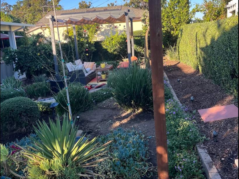 Low-water garden with agave, potted plants and gravel in the Anaheim area